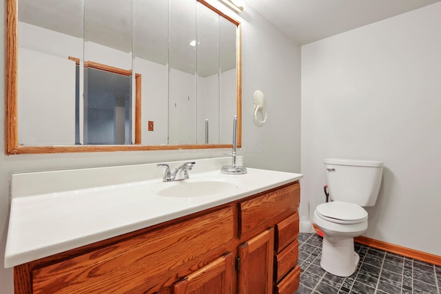2639 Halleck Dr, Columbus, OH 43209 - bathroom featuring baseboards, toilet, and vanity