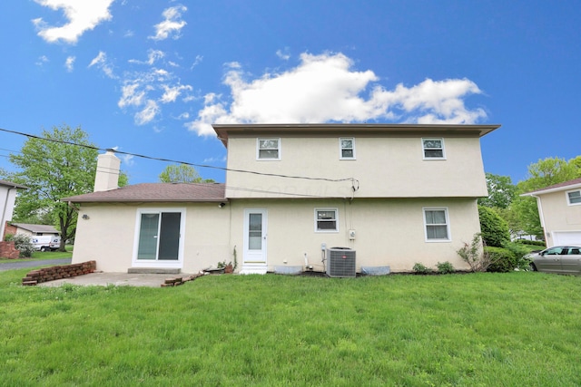 2639 Halleck Dr, Columbus, OH 43209 - rear view of property with central air condition unit, stucco siding, a lawn, and a chimney