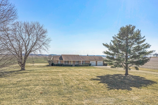 single story home featuring a front yard and a garage