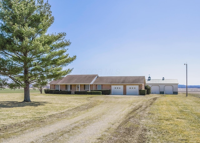 single story home with cooling unit, an attached garage, a front lawn, and dirt driveway