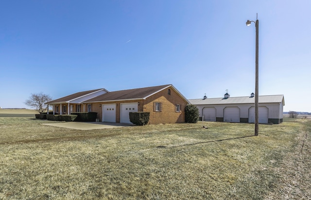 exterior space featuring concrete driveway and an attached garage