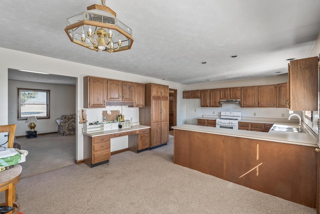 kitchen with brown cabinetry, white gas stove, a sink, under cabinet range hood, and light colored carpet