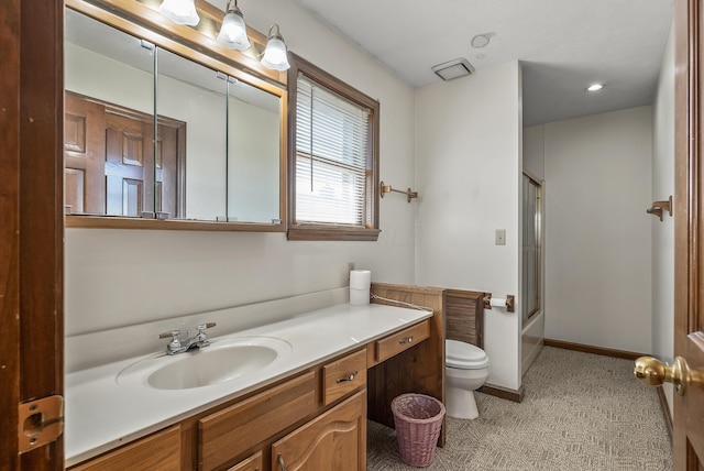 bathroom with baseboards, bath / shower combo with glass door, toilet, and vanity