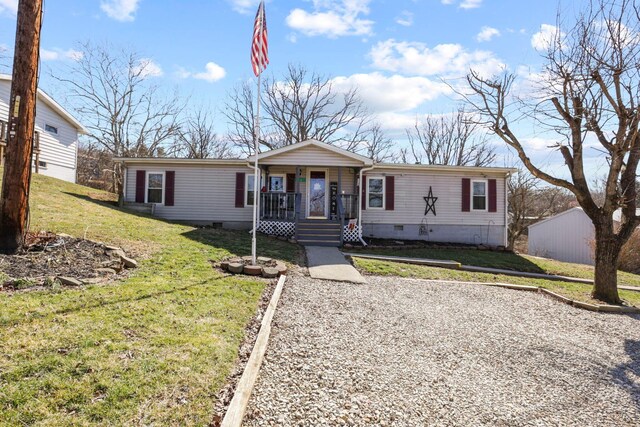 manufactured / mobile home featuring a porch, a front lawn, and crawl space