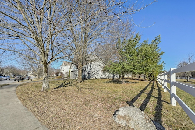 view of front of house featuring a front yard and fence