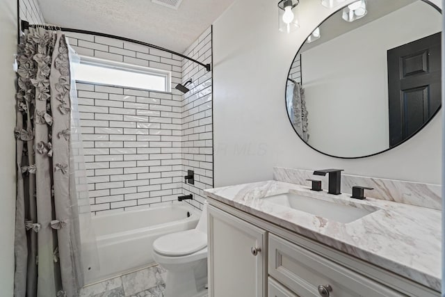 full bath with toilet, marble finish floor, a textured ceiling, shower / tub combo, and vanity