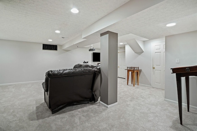 carpeted living area with recessed lighting, visible vents, baseboards, and a textured ceiling