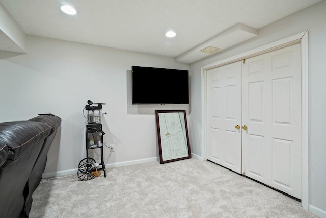 interior space with recessed lighting, carpet, and baseboards