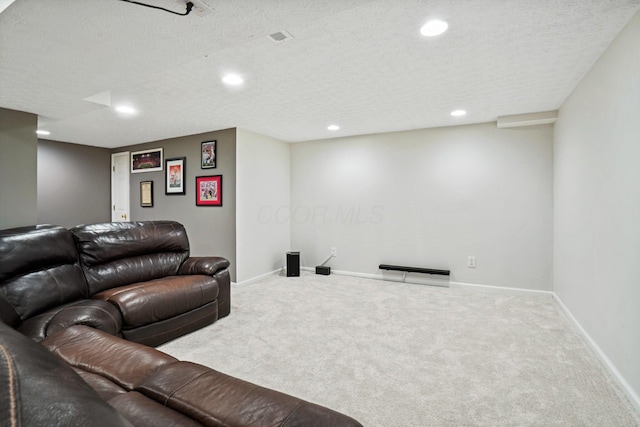 living area featuring a textured ceiling, baseboards, and carpet floors