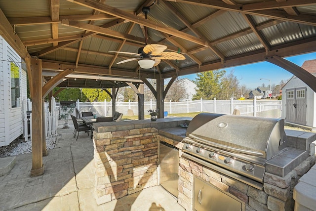 view of patio with a gazebo, area for grilling, outdoor dining area, and a fenced backyard