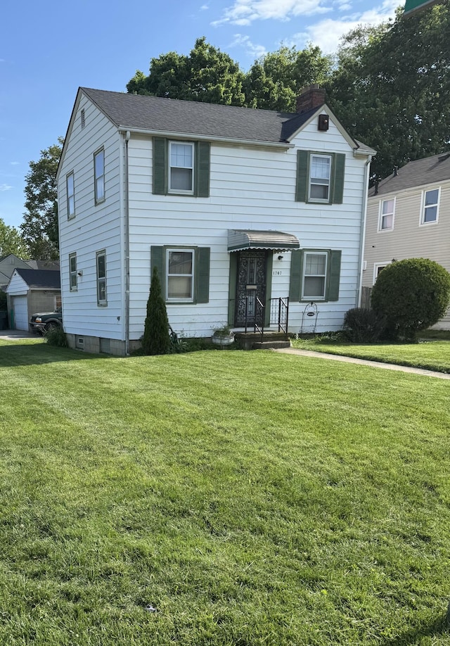1767 Forest St, Columbus, OH 43206 - traditional-style house with a chimney, a front lawn, and roof with shingles