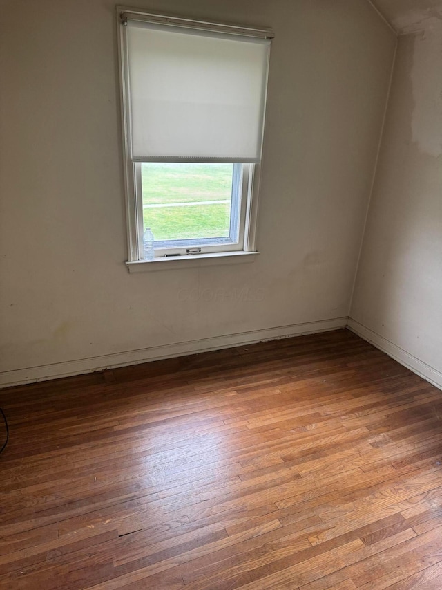 1767 Forest St, Columbus, OH 43206 - empty room with wood finished floors and baseboards