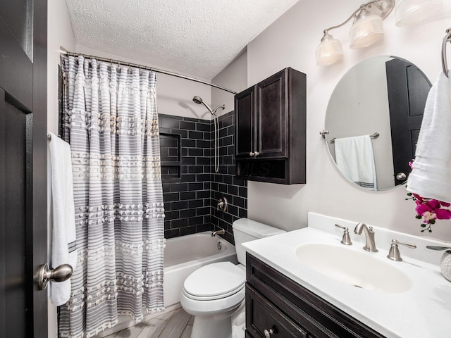 full bathroom featuring a textured ceiling, shower / bath combination with curtain, vanity, and toilet