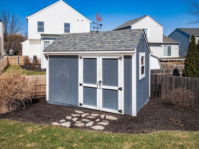 view of shed with a fenced backyard