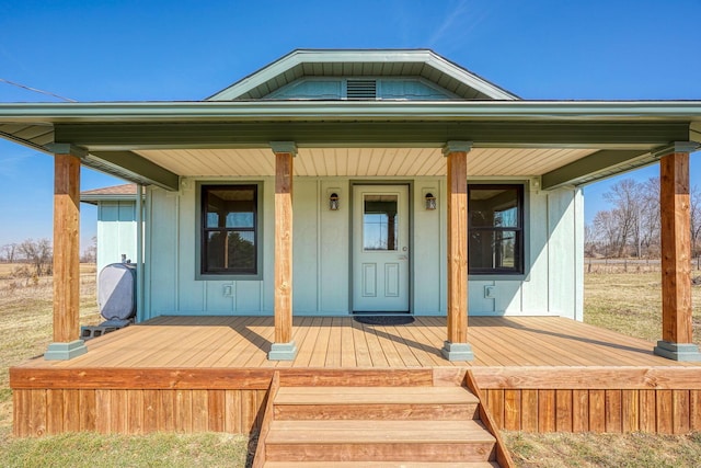 doorway to property with a porch