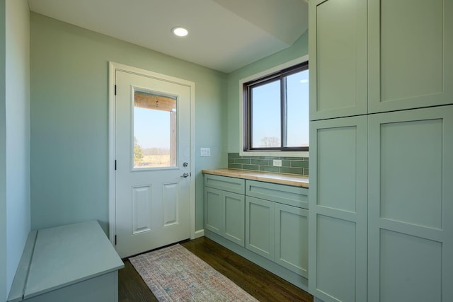 interior space with plenty of natural light, dark wood-style floors, and recessed lighting