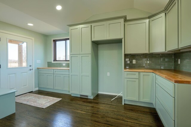 kitchen featuring recessed lighting, backsplash, butcher block countertops, and dark wood-style floors