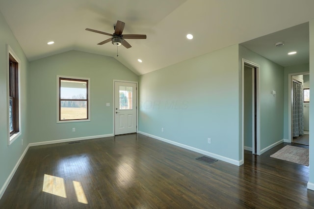 unfurnished room featuring baseboards, dark wood finished floors, vaulted ceiling, recessed lighting, and a ceiling fan