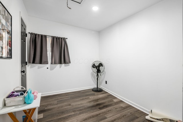 interior space featuring recessed lighting, baseboards, and dark wood-style flooring