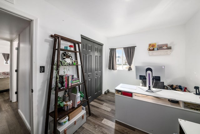 office featuring baseboards and dark wood-type flooring