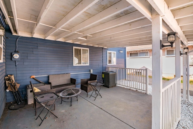 view of patio with a fire pit