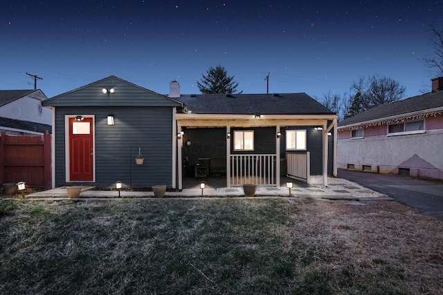 rear view of property with fence