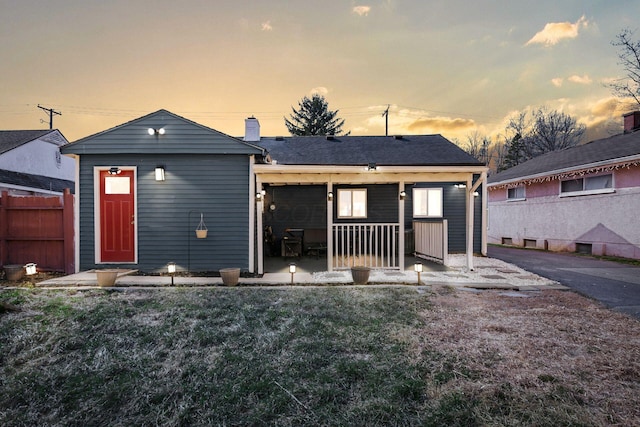 back of house featuring a patio area and fence