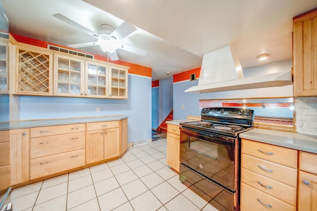 kitchen with ventilation hood, electric range, light brown cabinetry, and light countertops