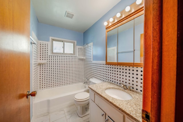 bathroom featuring vanity, visible vents, toilet, marble finish floor, and shower / bathtub combination