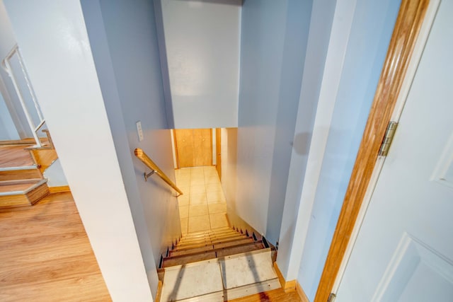 staircase featuring wood finished floors