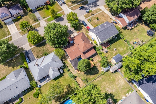 birds eye view of property with a residential view