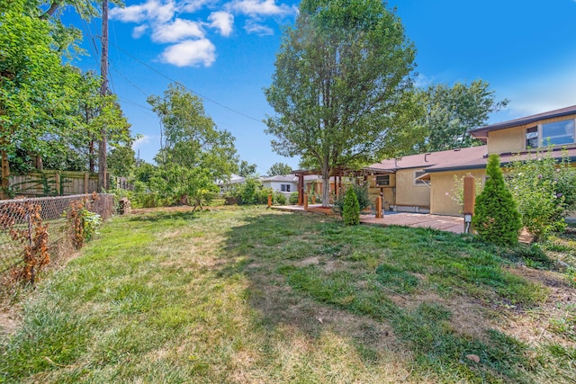 view of yard with a patio area and a fenced backyard