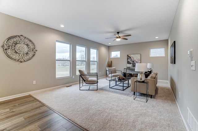 living room with visible vents, baseboards, ceiling fan, recessed lighting, and wood finished floors