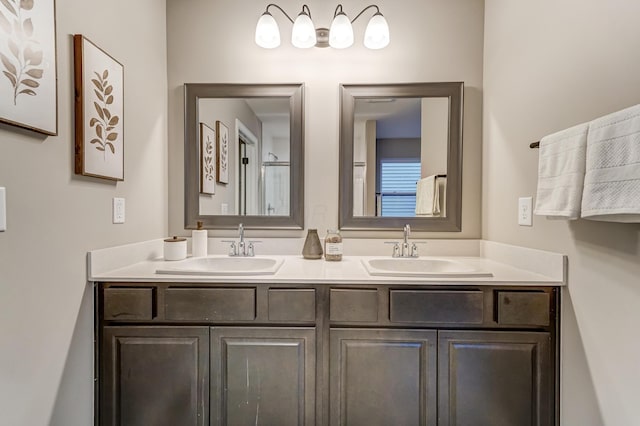 bathroom featuring a sink and double vanity