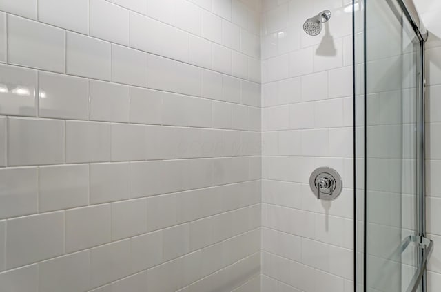 full bathroom with tiled shower