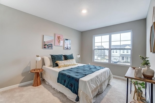 bedroom with carpet flooring and baseboards