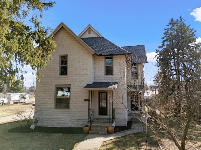 view of front of home with roof with shingles