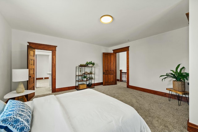 carpeted bedroom with baseboards