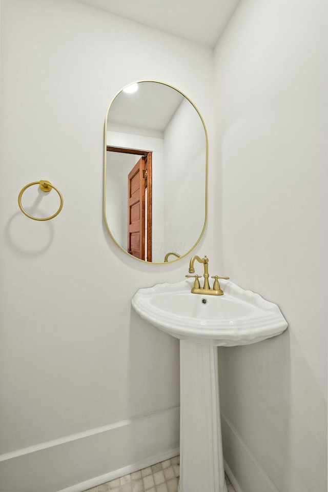 bathroom with tile patterned floors and a sink