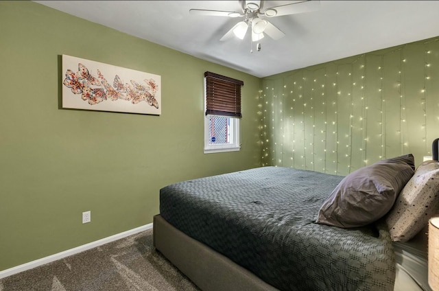 bedroom with carpet flooring, a ceiling fan, and baseboards