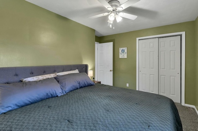 bedroom with a closet, carpet flooring, baseboards, and a ceiling fan