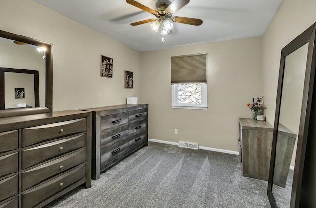 bedroom featuring a ceiling fan, baseboards, visible vents, and dark carpet