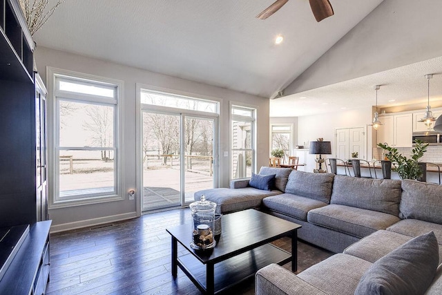 living room with high vaulted ceiling, a ceiling fan, dark wood finished floors, recessed lighting, and baseboards