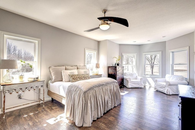 bedroom featuring dark wood-style floors and ceiling fan