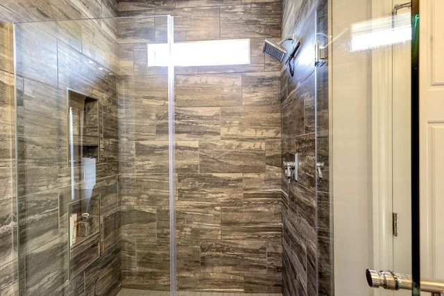 bathroom with a shower stall