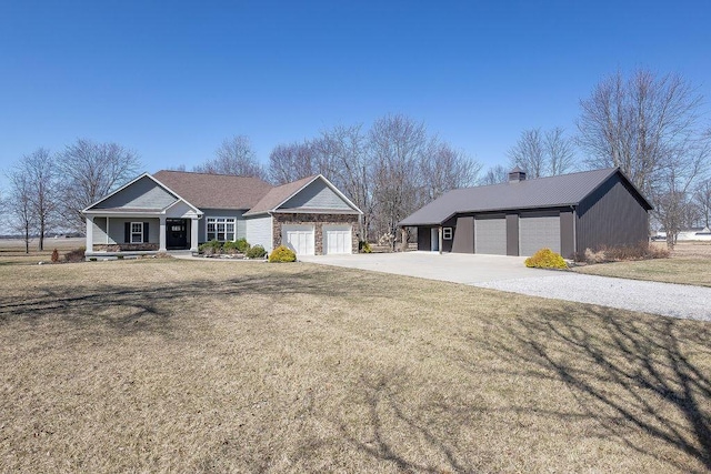 view of front of property featuring a front yard, concrete driveway, a garage, and a chimney