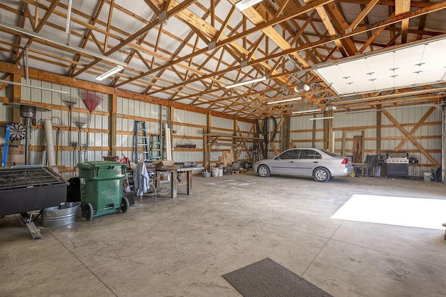 garage with metal wall and a garage door opener