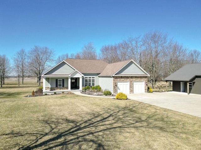 view of front of home with stone siding, an attached garage, concrete driveway, and a front lawn