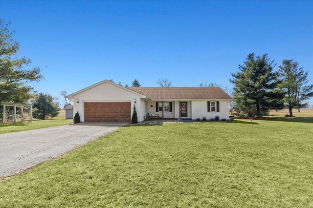 ranch-style home with a garage, driveway, and a front yard