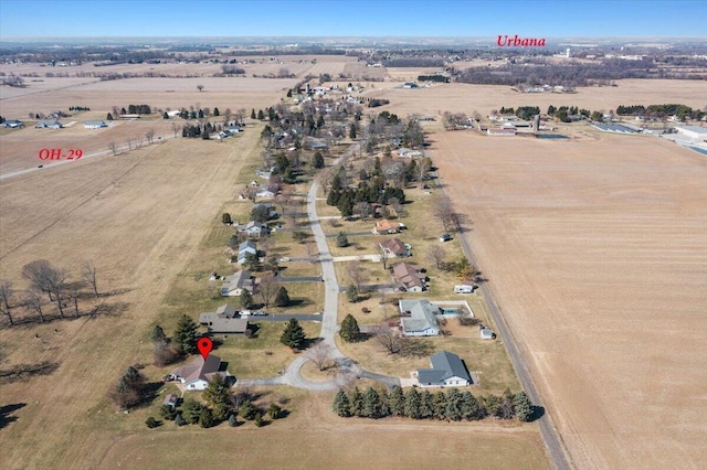 birds eye view of property with a rural view